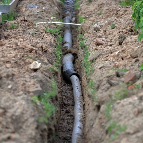 a main water line laying in a trench