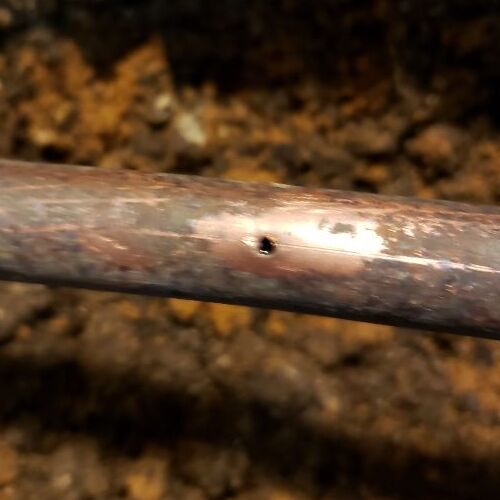 A Hole in a Copper Pipe